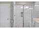 Elegant walk-in shower featuring glass enclosure, subway tile, bench, and stylish niche shelving at 69 Alex Farm Ct # 21, Zebulon, NC 27597