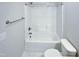 Clean bathroom featuring a shower-tub combo with brushed nickel fixtures and marble tiling at 69 Azul Dr, Clayton, NC 27520