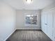 Bedroom features neutral walls, carpet floors, a window, and double closets at 69 Azul Dr, Clayton, NC 27520