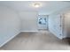 Bedroom featuring neutral paint, gray carpet, and a double-hung window at 69 Azul Dr, Clayton, NC 27520