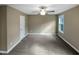 Bedroom featuring carpet floors, a ceiling fan, and a double-door closet at 69 Azul Dr, Clayton, NC 27520