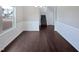 Bright dining room features dark hardwood floors, and a large window at 69 Azul Dr, Clayton, NC 27520