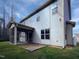 Two-story home featuring a screened-in porch, vinyl siding, and an open patio at 69 Azul Dr, Clayton, NC 27520
