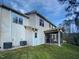 Rear exterior of a two-story home with vinyl siding and a screened-in porch at 69 Azul Dr, Clayton, NC 27520