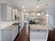 Modern kitchen with granite countertops, stainless steel appliances, and gray cabinets at 69 Azul Dr, Clayton, NC 27520