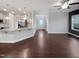 An open living space with a view of the kitchen featuring granite countertops and stainless steel appliances at 69 Azul Dr, Clayton, NC 27520