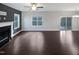 Bright and airy living room with hardwood floors, a fireplace, and access to the screened in porch at 69 Azul Dr, Clayton, NC 27520