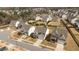 An aerial view of a residential area with manicured lawns, lush trees and well-maintained houses at 717 Tailrace Falls Ct, Wake Forest, NC 27587