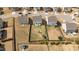 Aerial view of fenced backyards with play areas, including a trampoline, swing set, and storage shed at 717 Tailrace Falls Ct, Wake Forest, NC 27587