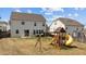 Spacious backyard featuring a playset and hot tub, perfect for outdoor enjoyment at 717 Tailrace Falls Ct, Wake Forest, NC 27587