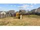 Large backyard featuring a shed and a playset, offering lots of recreational opportunities at 717 Tailrace Falls Ct, Wake Forest, NC 27587