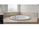 Close up of bathtub and tiled surround at 717 Tailrace Falls Ct, Wake Forest, NC 27587