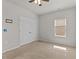 Bedroom featuring a ceiling fan, neutral walls, and double door closet at 717 Tailrace Falls Ct, Wake Forest, NC 27587