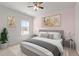 Bedroom with a window, bed, and two side tables at 717 Tailrace Falls Ct, Wake Forest, NC 27587