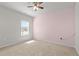 Bright bedroom with neutral walls, carpeted floors, and a ceiling fan at 717 Tailrace Falls Ct, Wake Forest, NC 27587