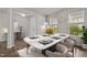 Cozy dining room with a marble-topped table, seating for six, and a large window at 717 Tailrace Falls Ct, Wake Forest, NC 27587