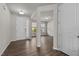 Bright entryway with hardwood floors offers a welcoming space with natural light and neutral wall paint at 717 Tailrace Falls Ct, Wake Forest, NC 27587
