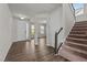 Bright entryway with hardwood floors offers a welcoming space with natural light and neutral wall paint at 717 Tailrace Falls Ct, Wake Forest, NC 27587
