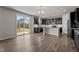 Well-lit kitchen area with stainless steel appliances, a center island, and a view of the backyard at 717 Tailrace Falls Ct, Wake Forest, NC 27587
