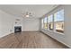 Living room featuring a fireplace, ceiling fan, and natural light from the windows at 717 Tailrace Falls Ct, Wake Forest, NC 27587