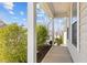 Cozy porch with white columns and landscaping at 717 Tailrace Falls Ct, Wake Forest, NC 27587