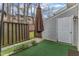 Cozy outdoor area featuring manicured turf and privacy fence for relaxed outdoor enjoyment at 7305 Sandy Creek Dr, Raleigh, NC 27615