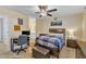 Inviting bedroom boasting a work space, neutral walls, and ceiling fan for added comfort and style at 7305 Sandy Creek Dr, Raleigh, NC 27615