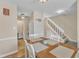 Cozy dining room with natural light, hardwood floors and a view to the staircase at 7305 Sandy Creek Dr, Raleigh, NC 27615