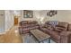 Comfortable living room has leather furniture, an area rug, and is decorated with Pittsburgh Steelers memorabilia at 7305 Sandy Creek Dr, Raleigh, NC 27615