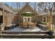 Outdoor deck area featuring a dining table with umbrella and bench seating at 9501 Coachway, Chapel Hill, NC 27516