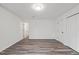 This bedroom has gray hardwood floors and bright white paint at 1001 Atchison St, Garner, NC 27529