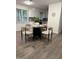 Inviting dining area with modern table setting and abundant natural light at 1001 Atchison St, Garner, NC 27529