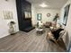 Cozy living room featuring a striking black brick fireplace and modern decor at 1001 Atchison St, Garner, NC 27529