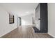 Inviting living area with wood flooring and a standout black brick fireplace as a focal point at 1001 Atchison St, Garner, NC 27529
