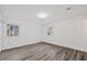 Light-filled bedroom features new floors, large windows and neutral paint for a clean and cozy space at 1001 Atchison St, Garner, NC 27529