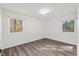 Bright bedroom with large windows offering views, complemented by sleek flooring, creating a serene atmosphere at 1001 Atchison St, Garner, NC 27529