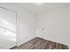 Well-lit bedroom featuring new floors, a spacious closet, and a freshly painted door for a modern look at 1001 Atchison St, Garner, NC 27529