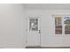 Bright entryway featuring a white door with glass insert, neutral walls, and a view to the outdoors at 1001 Atchison St, Garner, NC 27529