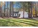 Lovely home with well-kept lawn and mature trees provides a sense of privacy and tranquility at 1001 Atchison St, Garner, NC 27529