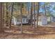 Inviting single-story home surrounded by mature trees and natural landscaping adding to the property's charm at 1001 Atchison St, Garner, NC 27529