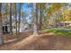 Exterior view of a well-maintained home surrounded by mature trees providing shade and privacy at 1001 Atchison St, Garner, NC 27529