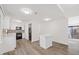 Open-concept kitchen featuring modern appliances, white cabinetry, and stylish flooring for cooking and entertaining at 1001 Atchison St, Garner, NC 27529