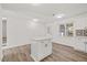 Open kitchen concept featuring an island, updated appliances, and a view to the backyard at 1001 Atchison St, Garner, NC 27529