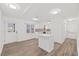 Open-concept kitchen with white cabinetry, modern island, and ample natural light creating a welcoming atmosphere at 1001 Atchison St, Garner, NC 27529