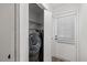 Laundry room with washer and dryer, shelving, and access to the outdoors at 1001 Atchison St, Garner, NC 27529