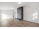 Living room with fireplace, hardwood floors, and great natural light throughout the space at 1001 Atchison St, Garner, NC 27529