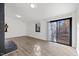 Living room features a black brick fireplace, hardwood floors, sliding glass doors, and natural light at 1001 Atchison St, Garner, NC 27529