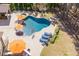 Aerial view of private backyard oasis with in-ground pool, hot tub, and outdoor entertaining space at 1001 Welch Ln, Raleigh, NC 27614