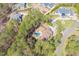 A captivating aerial view showcasing a beautiful home nestled amongst lush trees and pristine landscaping at 1001 Welch Ln, Raleigh, NC 27614