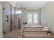 Spa bathroom featuring a glass shower, tub with tile surround, and plantation shutters at 1001 Welch Ln, Raleigh, NC 27614